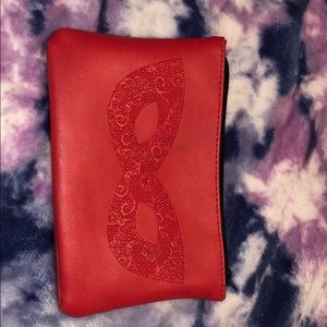 IPSY clutch bag, red with mask design